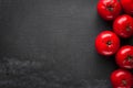 Group of red and ripe tomatoes making a frame on the dark black and gray textured background. template for advertising with copy Royalty Free Stock Photo