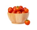 Group red tomatoes in a wooden bowl isolated