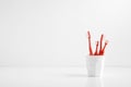 Group of red toothbrush in a plastic cup with a blank space for a text Royalty Free Stock Photo