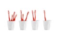 Group of red toothbrush in a plastic cup isolated on white background Royalty Free Stock Photo