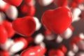 Group of red and white candy Valentines heart floating on chocolate background as sweet candy rainy. Holiday and affection love