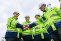 Group of Refinery Engineer team workers Join Hand for Collaboration Working. Industrial Worker Mix Together. Workers hands meeting Royalty Free Stock Photo