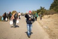 Group of refugees family, standing and mainking the V of Victory on the Croatia Serbia border, on the Balkans Route