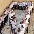 A group of religious people celebrate Simchat Torah. Sing songs and hold Torah scrolls