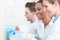 Group of researchers during work on devices in laboratory Royalty Free Stock Photo