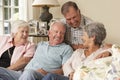 Group Of Retired Friends Sitting On Sofa At Home Together Royalty Free Stock Photo