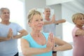 Group of retires people doing stretching