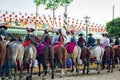 Group of riders on horseback at the April Fair, Seville Fair Feria de Sevilla Royalty Free Stock Photo