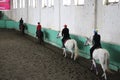 A group of riders on horseback trains in the arena of equestrian sports Royalty Free Stock Photo