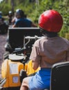 Group of riders riding ATV vehicle crossing forest rural road, process of driving rental vehicle, all terrain quad bike vehicle,