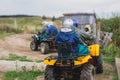 Group of riders riding atv vehicle on off road track, process of driving ATV vehicle, all terrain quad bike vehicle, during Royalty Free Stock Photo