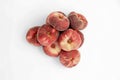 Group of ripe flat peaches, isolated on a white background Royalty Free Stock Photo