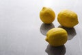 Closeup of juicy lemons on the grey kitchen table.Empty space