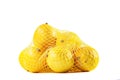 group of ripe lemons in a mesh bag against white background Royalty Free Stock Photo