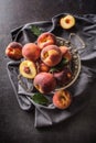 A group a ripe peaches in rustic bowl Royalty Free Stock Photo