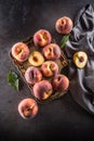 A group a ripe peaches in rustic bowl Royalty Free Stock Photo