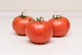 Group of ripe red tomatoes with green tassel