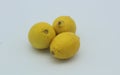 Group of ripe whole yellow lemon citrus fruit isolated on white background