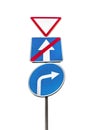 The group road traffic sign on pole, a driving direction