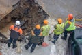 A group of road workers from public utilities in reflective special vests