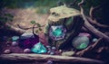 a group of rocks and crystals on the ground near a tree Royalty Free Stock Photo