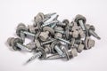 Group of roofing screws on a white background Royalty Free Stock Photo