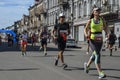 Group of runners racing at the city street during run competition in Kyiv