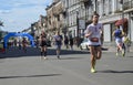 Group of runners racing at the city street during run competition in Kyiv
