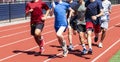 Group of runners training on a track together Royalty Free Stock Photo