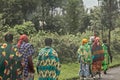 Group of rural Rwandan women in colorful traditionals clothes walking along the road, Kigali, Rwanda Royalty Free Stock Photo