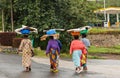 Group of Rwandan women in colorful traditionals clothes wearing washbowls on their heads, Kigali, Rwanda