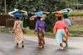 Group of Rwandan women in colorful traditionals clothes wearing washbowls on their heads, Kigali, Rwanda Royalty Free Stock Photo