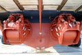 Pair of waterjets in the stern of a coastguard docked in drydock. Royalty Free Stock Photo