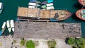 Group of sailing boats anchoring in marina next to jetty wooden pier. Aerial photo, high angle of view, bird eye Royalty Free Stock Photo