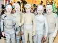 Group of school children wearing bandage costumes for maskenball