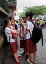 Group of school girl stand together at school gate, Vietnam