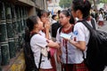 Group of school girl stand together at school gate, Vietnam