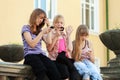 Group of school girls calling on the cell phones Royalty Free Stock Photo