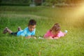 Group of school kids coloring outdoors looking happy