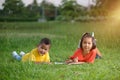 Group of school kids coloring outdoors looking happy