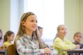 Group of school kids with notebooks in classroom Royalty Free Stock Photo