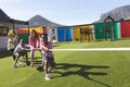 Group of school kids playing tug of war Royalty Free Stock Photo