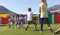 Group of school kids playing tug of war Royalty Free Stock Photo