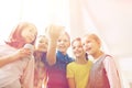 Group of school kids with smartphone and soda cans Royalty Free Stock Photo