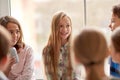 Group of school kids with soda cans in corridor Royalty Free Stock Photo