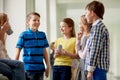 Group of school kids with soda cans in corridor Royalty Free Stock Photo