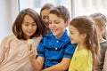 Group of school kids taking selfie with smartphone Royalty Free Stock Photo