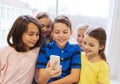 Group of school kids taking selfie with smartphone Royalty Free Stock Photo