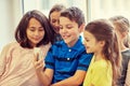 Group of school kids taking selfie with smartphone