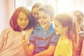 Group of school kids taking selfie with smartphone Royalty Free Stock Photo